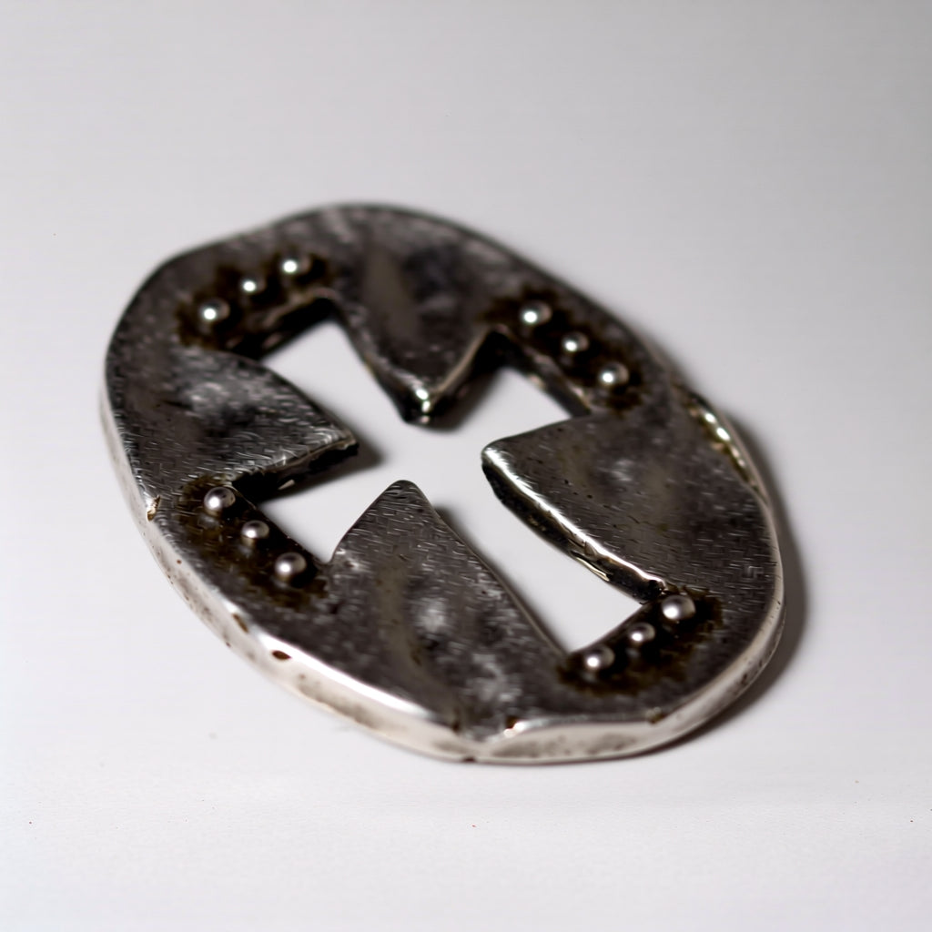 Metallic emblem with a design on a white background