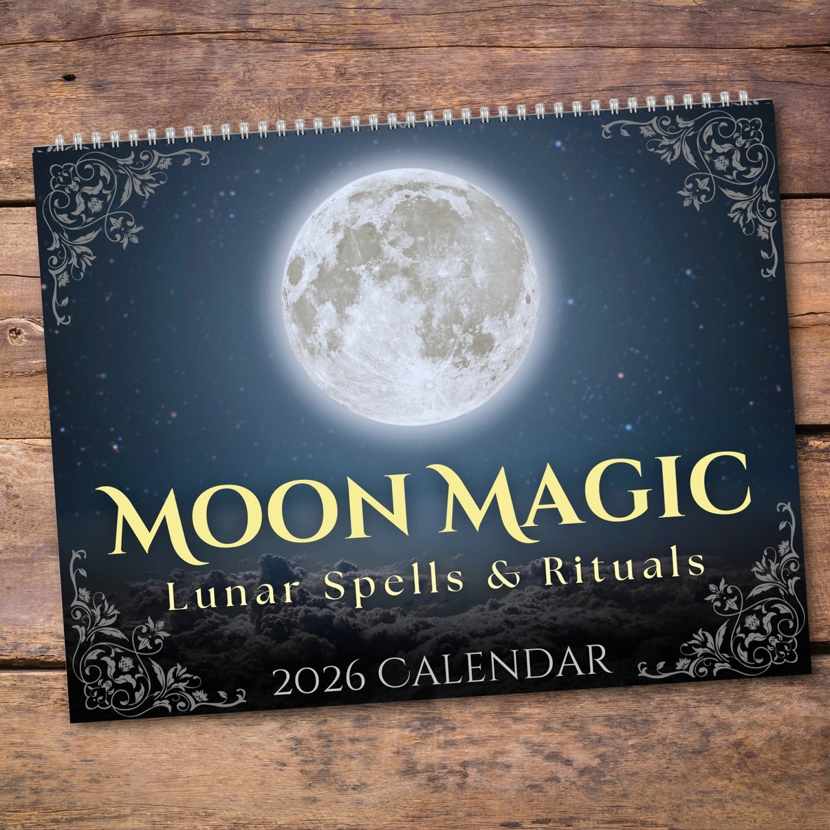 Calendar titled 'Moon Magic: Lunar Spells & Rituals' on a wooden surface