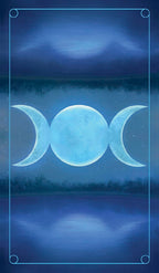Three blue moons over a dark landscape with a starry sky.