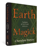 Book titled 'Earth Magick' by Cheralyn Darcey with green and orange design on a white background