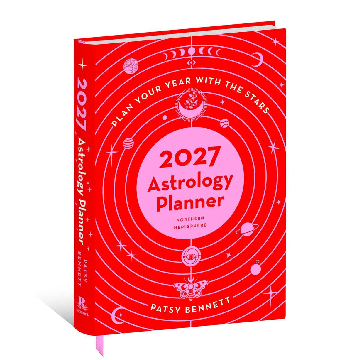 A hardcover astrology planner titled '2027 Astrology Planner' by Patsy Bennett, featuring a bright red cover with pink orbital rings, celestial illustrations, and white text, shown standing upright on a white background.