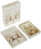 White Light Oracle card set with packaging and guidebook on a white background