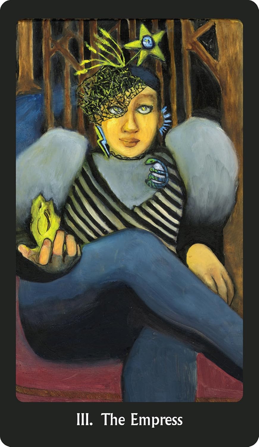Card featuring 'The Empress' from a tarot deck with a person holding a frog and wearing an elaborate headpiece.