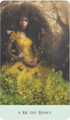 Woman in a yellow dress surrounded by nature elements on a tarot card.