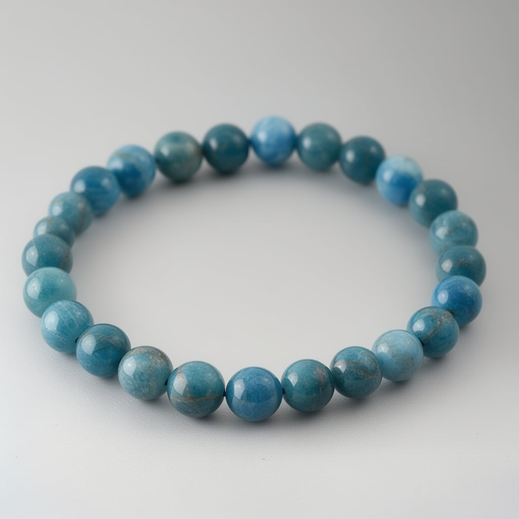 Blue beaded bracelet on a white background