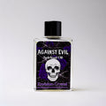 Bottle of 'Against Evil' spiritual oil with a skull design on a white background