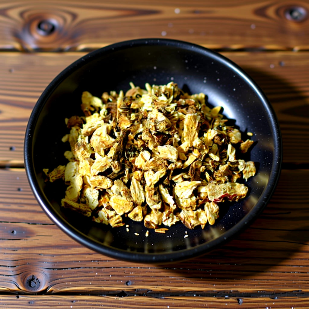 Black bowl with angelica root cut on a wooden surface