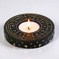 Decorative candle holder with zodiac symbols on a white background