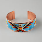 Beaded bracelet with colorful pattern on a gray background