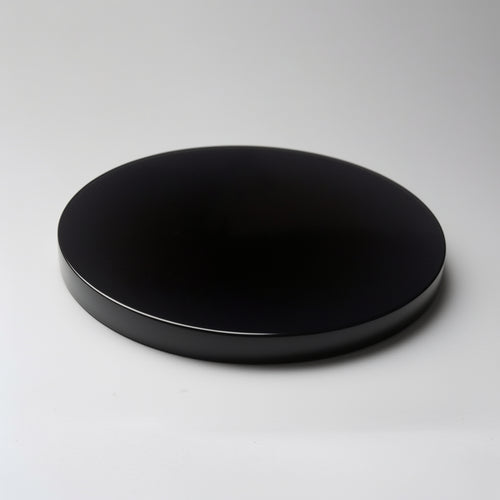 Black round object on a gray background