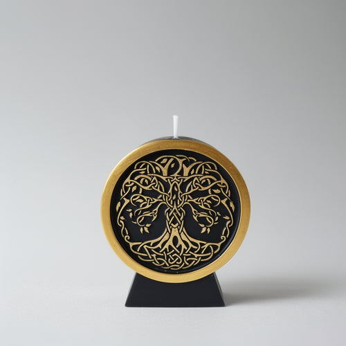 Decorative candle with intricate design on a gray background