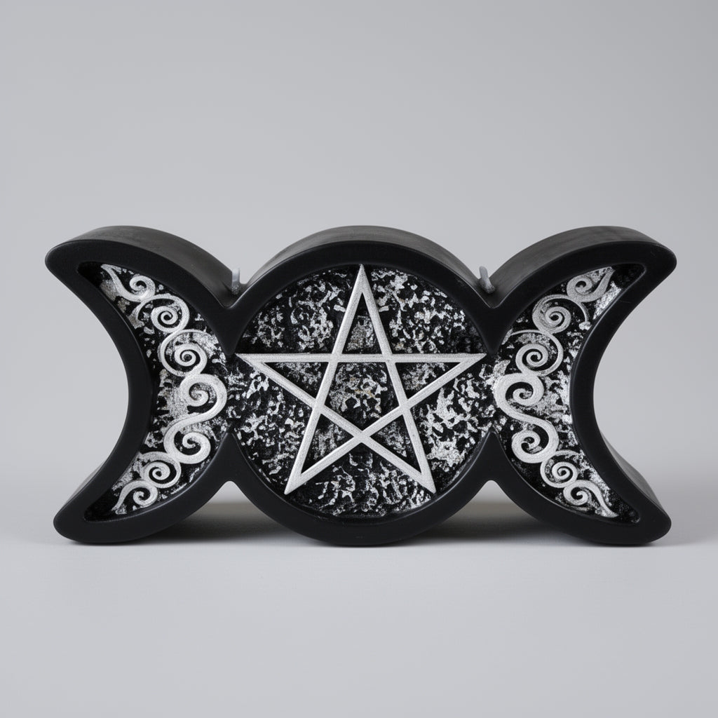 A black triple moon candle with a pentagram design on a gray background