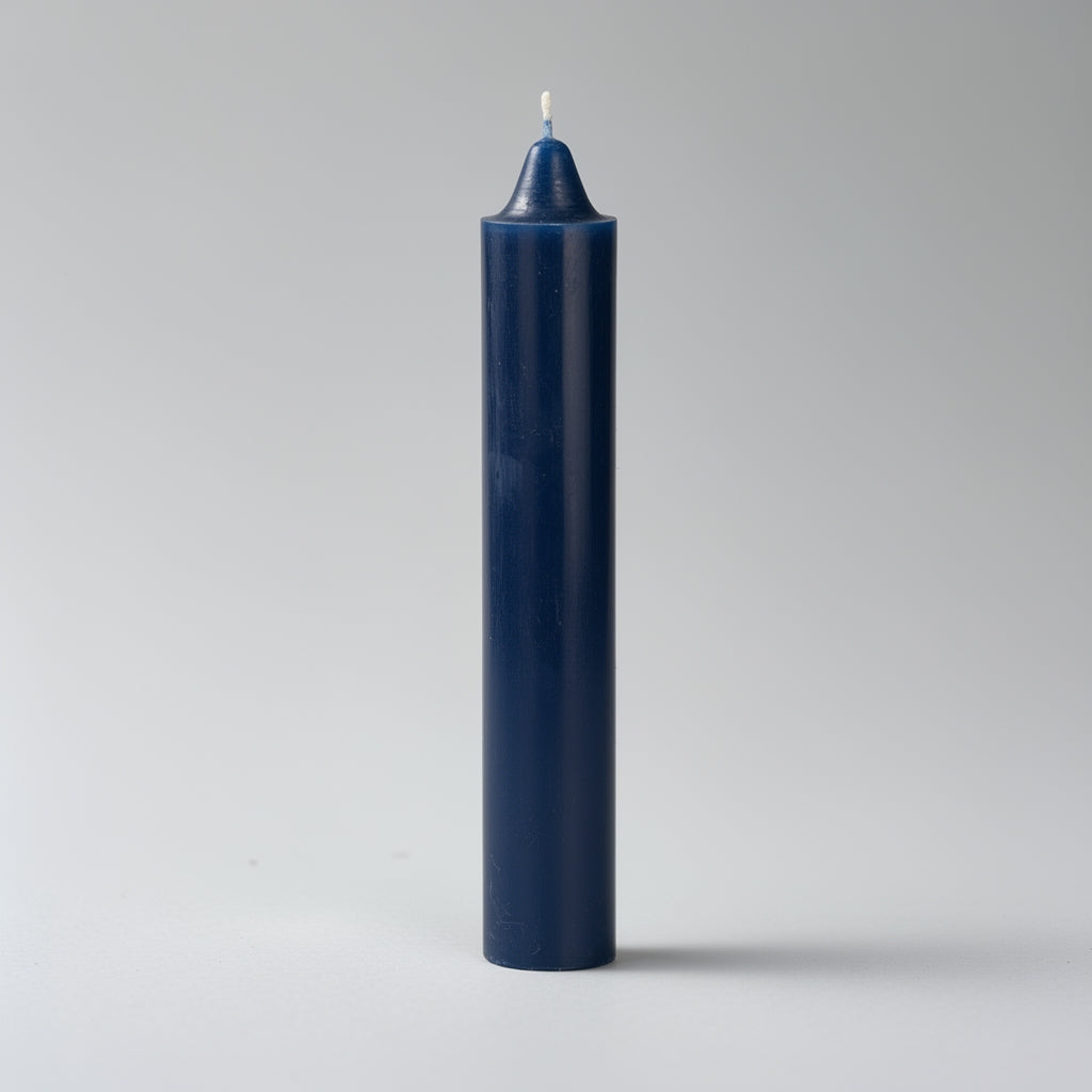 Navy blue candle on a light gray background