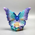 Colorful butterfly-shaped decorative item on a light gray background