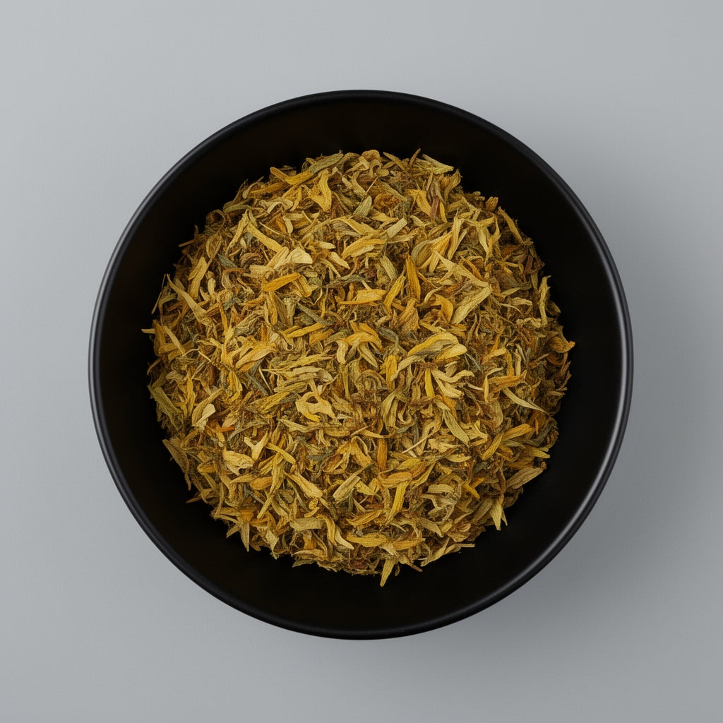 Black bowl filled with dried yellow flowers on a gray background