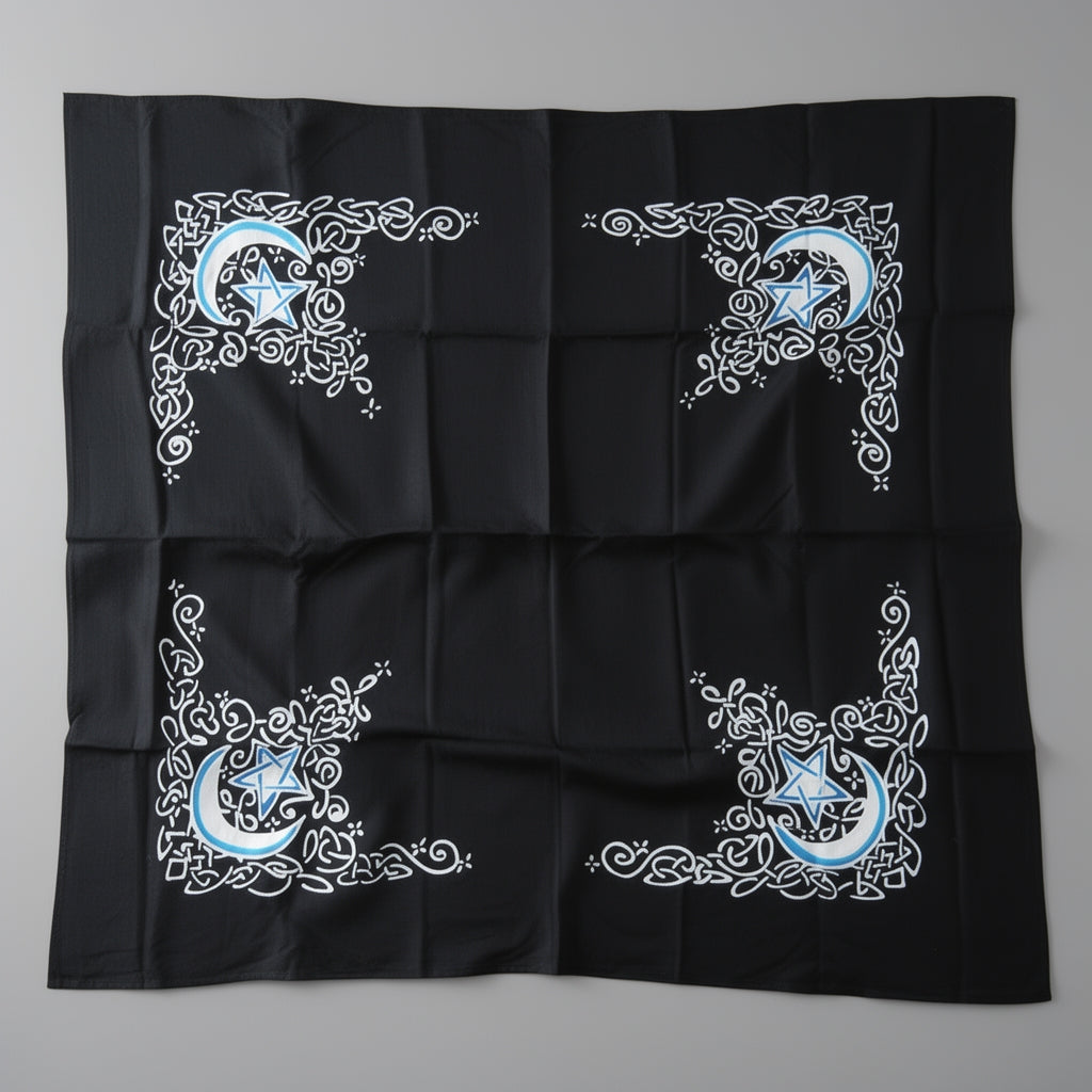 Black fabric with blue and white star and moon design on a gray background