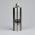 Stainless steel bottle with Celtic heart design on a gray background