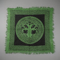 Green and black square cloth with Celtic knot design and tree of life symbol on a white background