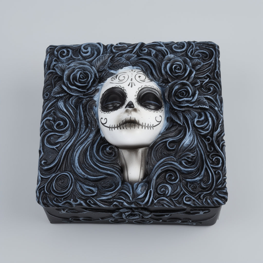 Decorative box with a skull design and floral patterns on a white background