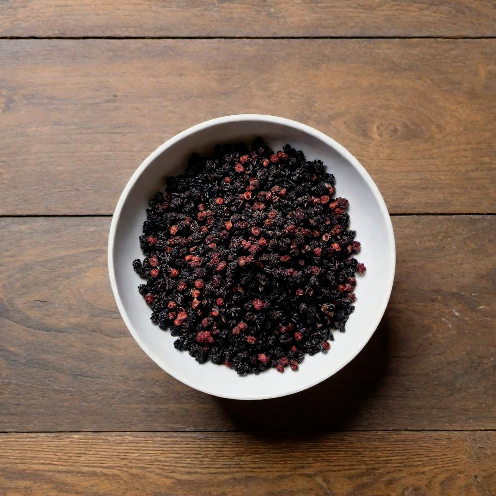 Elderberries in a white bowl