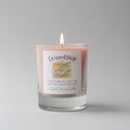 Candle with a 'Friendship' label on a gray background