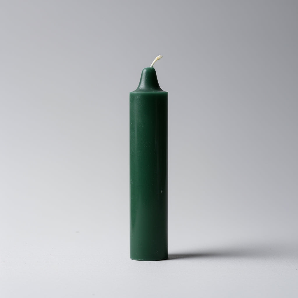 Green candle on a gray background