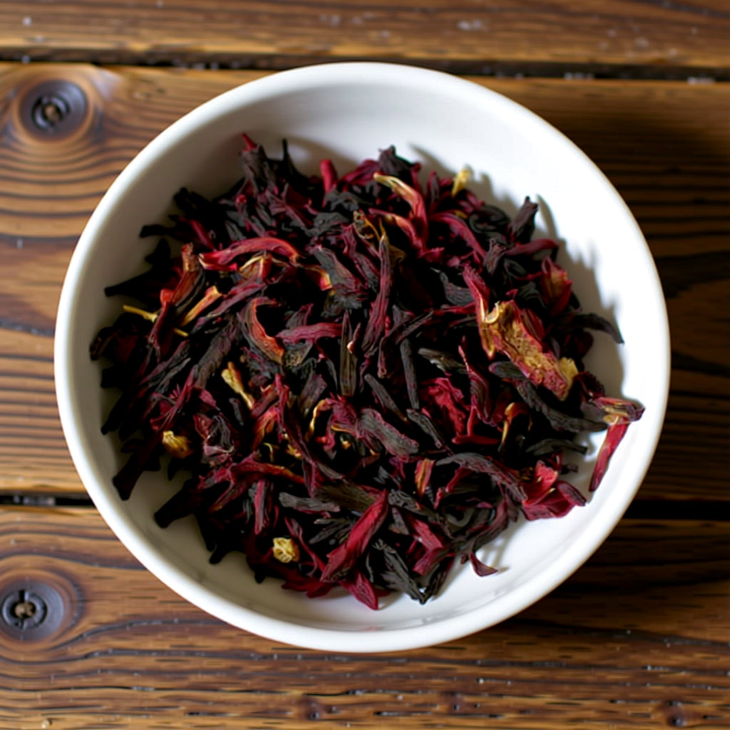 White bowl filled with dried hibiscus flowers on a wooden surface