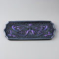 Decorative incense holder with purple butterfly design on a gray background