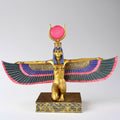 Decorative statue of a winged Egyptian deity on a white background
