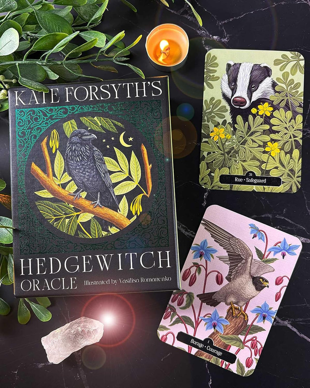 Hedge Witch Oracle book with cards and candle on a dark surface