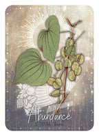 Card with green leaves and branches on a textured background with 'Abundance' text.