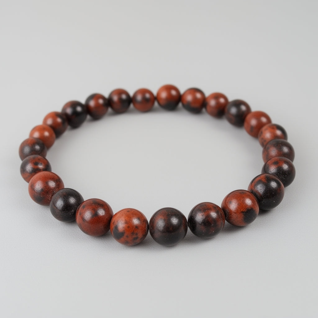 Bracelet with red and black beads on a light gray background