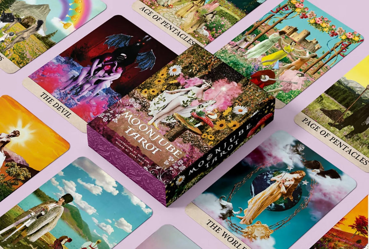 Collection of tarot cards with colorful artwork on a pink background