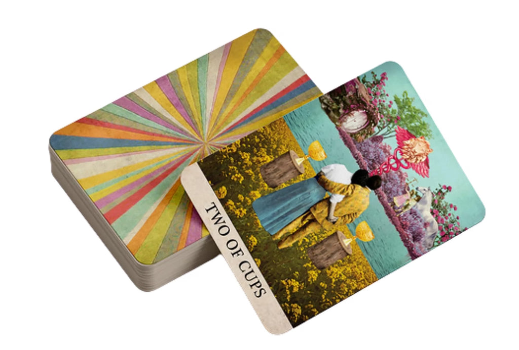 Card with 'Two of Cups' design featuring two people and a colorful sunburst pattern on a white background.