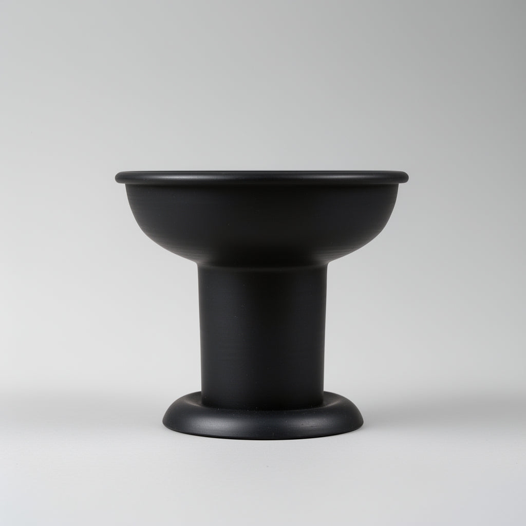 Black ceramic bowl on a light gray background