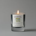 Candle with a label on a gray background