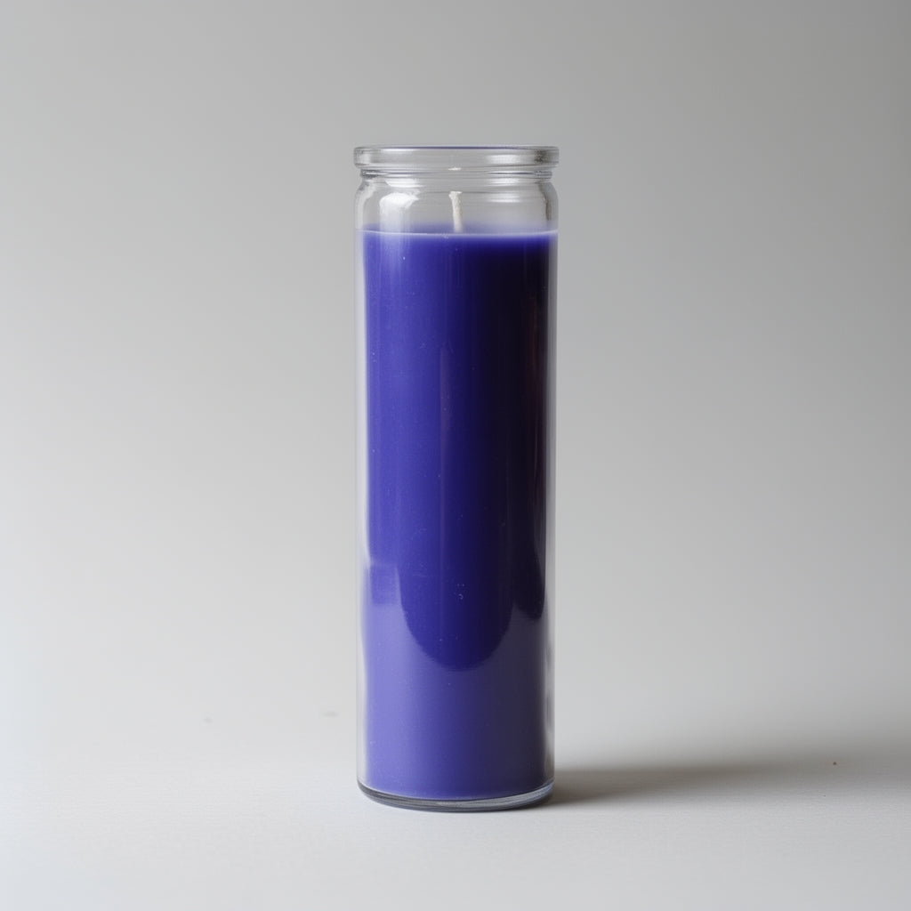 Purple candle in a clear glass jar on a white background