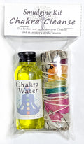 Smudging kit labeled 'Chakra Cleanse' with a bottle of 'Chakra Water' and wrapped sticks on a white background.
