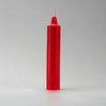 Red candle on a gray background