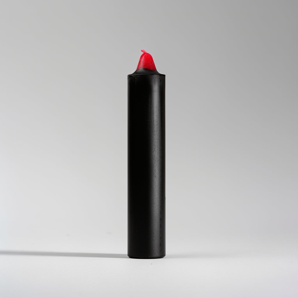 Black and red candle on a light gray background