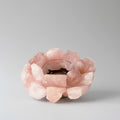 Pink crystal candle holder on a white background.