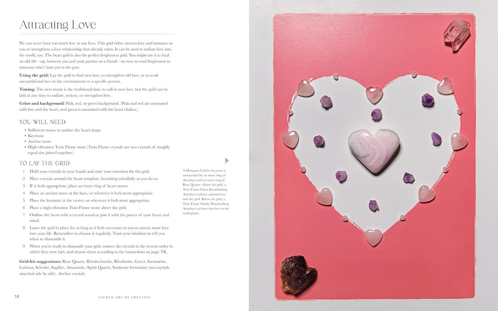 An open book spread showing a guide titled 'Attracting Love' with text on the left page and a pink heart-shaped crystal grid kit on the right page, decorated with pink and purple crystals and a central heart.