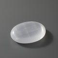 Clear crystal stone on a gray background