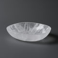 Clear crystal bowl on a dark gray background