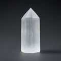 Clear crystal tower on a dark background