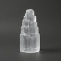 Clear crystal formation on a dark gray background