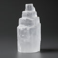Clear crystal tower on a dark background