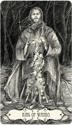 King of Wands tarot card with a figure in a forest