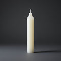 White candle on a dark gray background