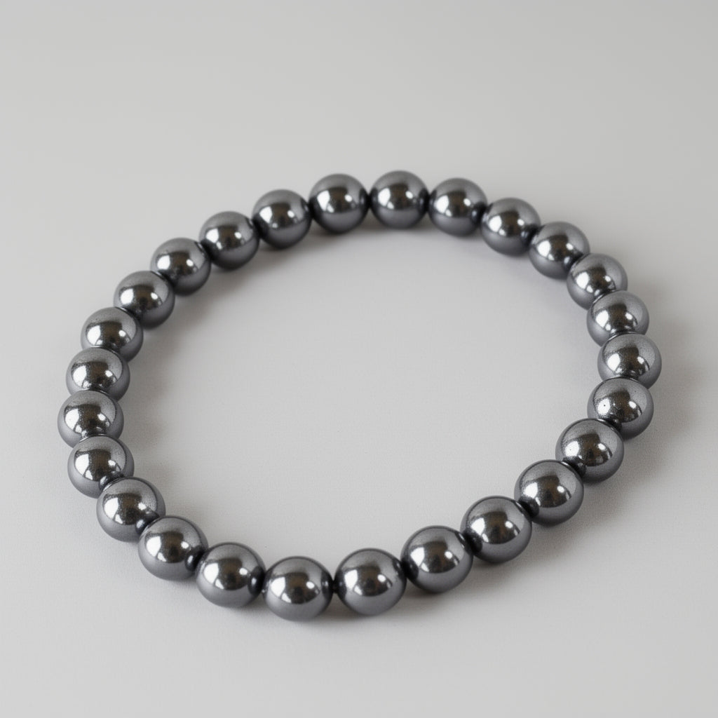 Metallic beaded bracelet on a light gray background